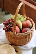 red apples in brown woven basket
