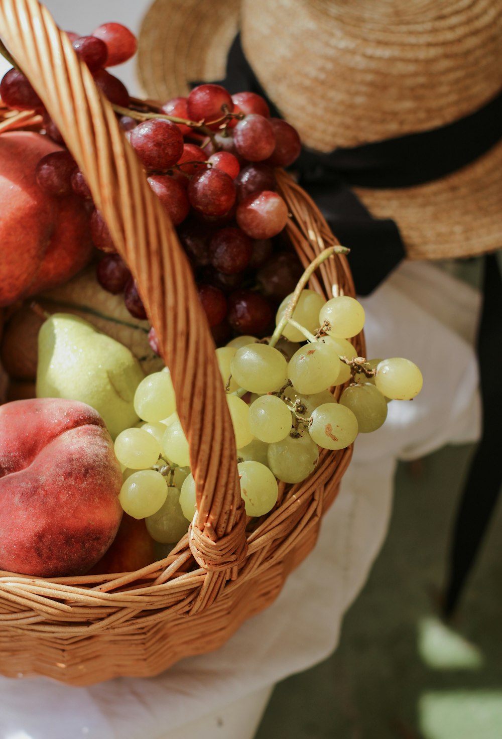 green and red apples in brown woven basket