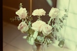 Soft pastel flower arrangements decorating a cozy wedding living room
