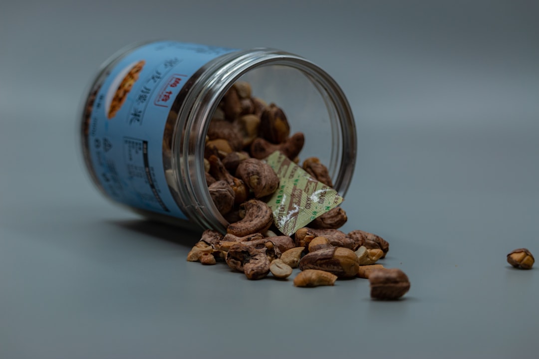 brown peanuts in clear glass jar