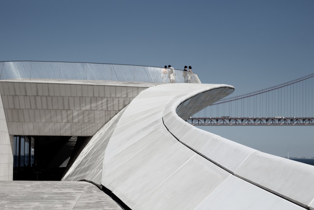 people walking on white concrete building during daytime