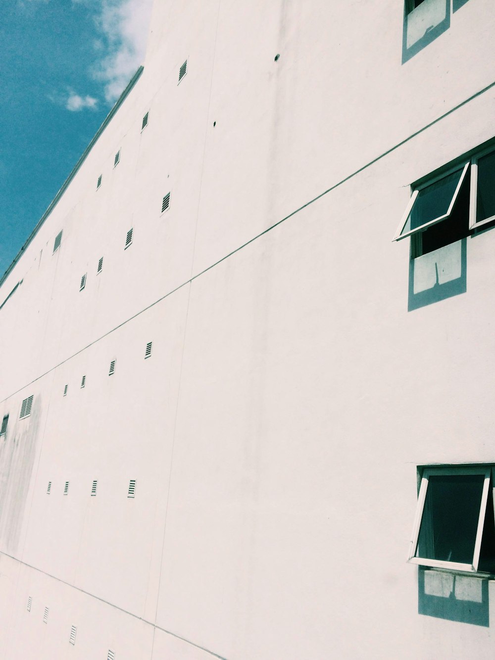 white concrete building under blue sky during daytime