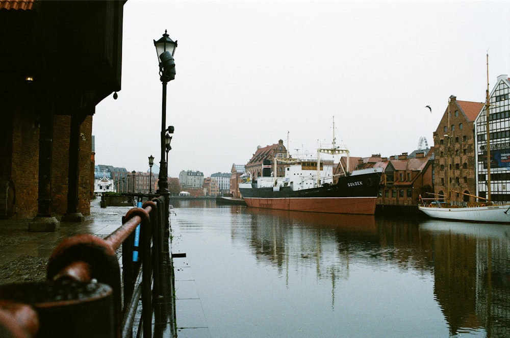 brown boat on water during daytime