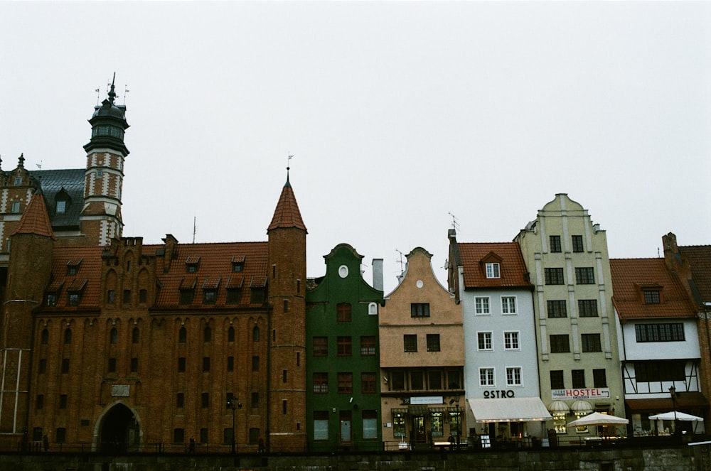 brown and green concrete building under white sky during daytime