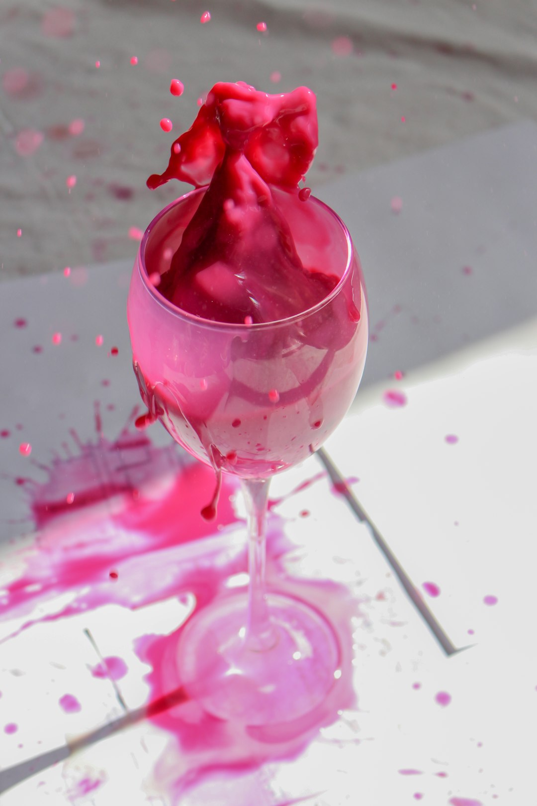 red rose in clear wine glass