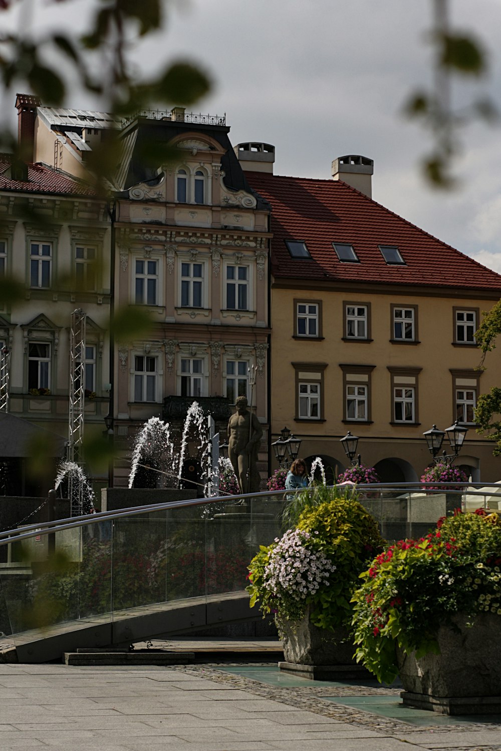 water fountain in front of brown and white concrete building