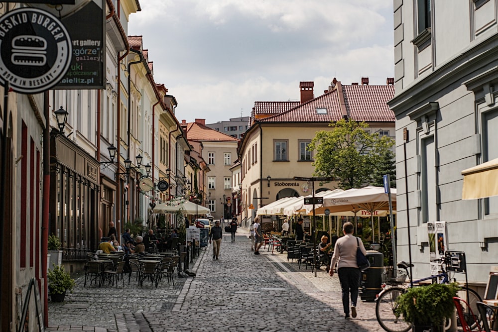 people walking on street near buildings during daytime