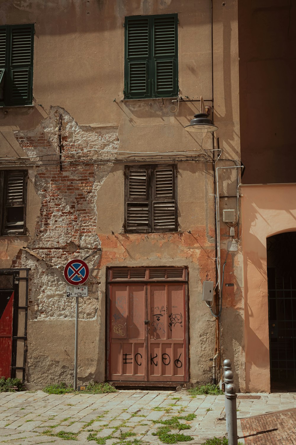 brown wooden door on brown concrete building