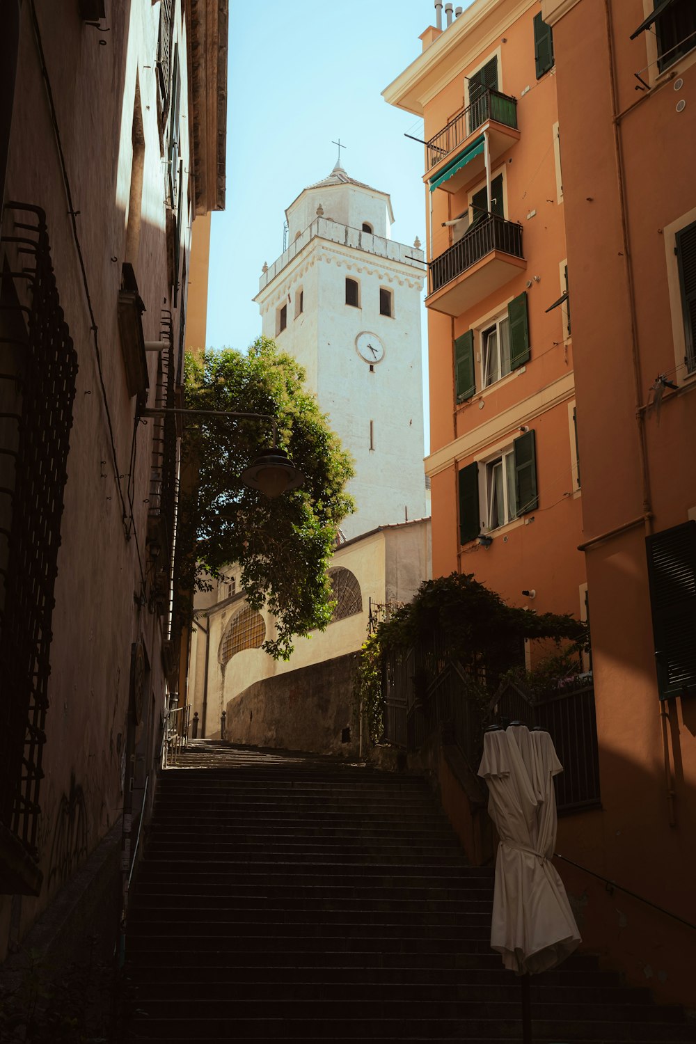 man in white thobe walking on street during daytime