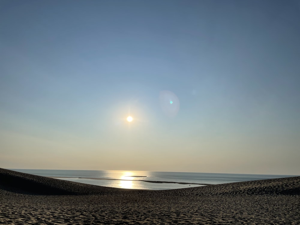 body of water under blue sky during daytime