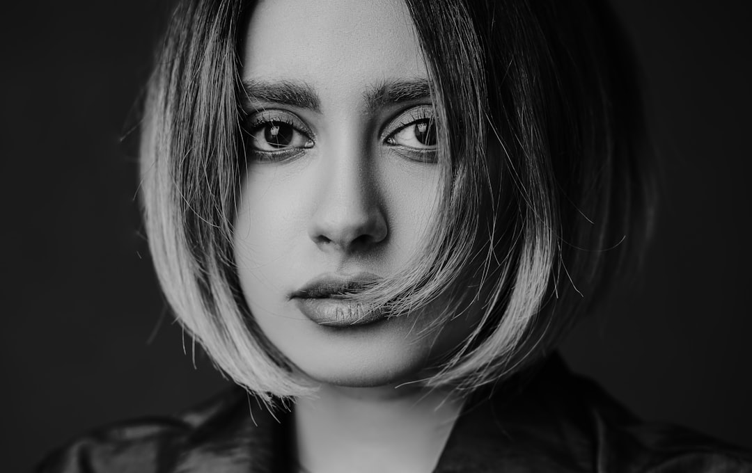 woman in black shirt with black mascara