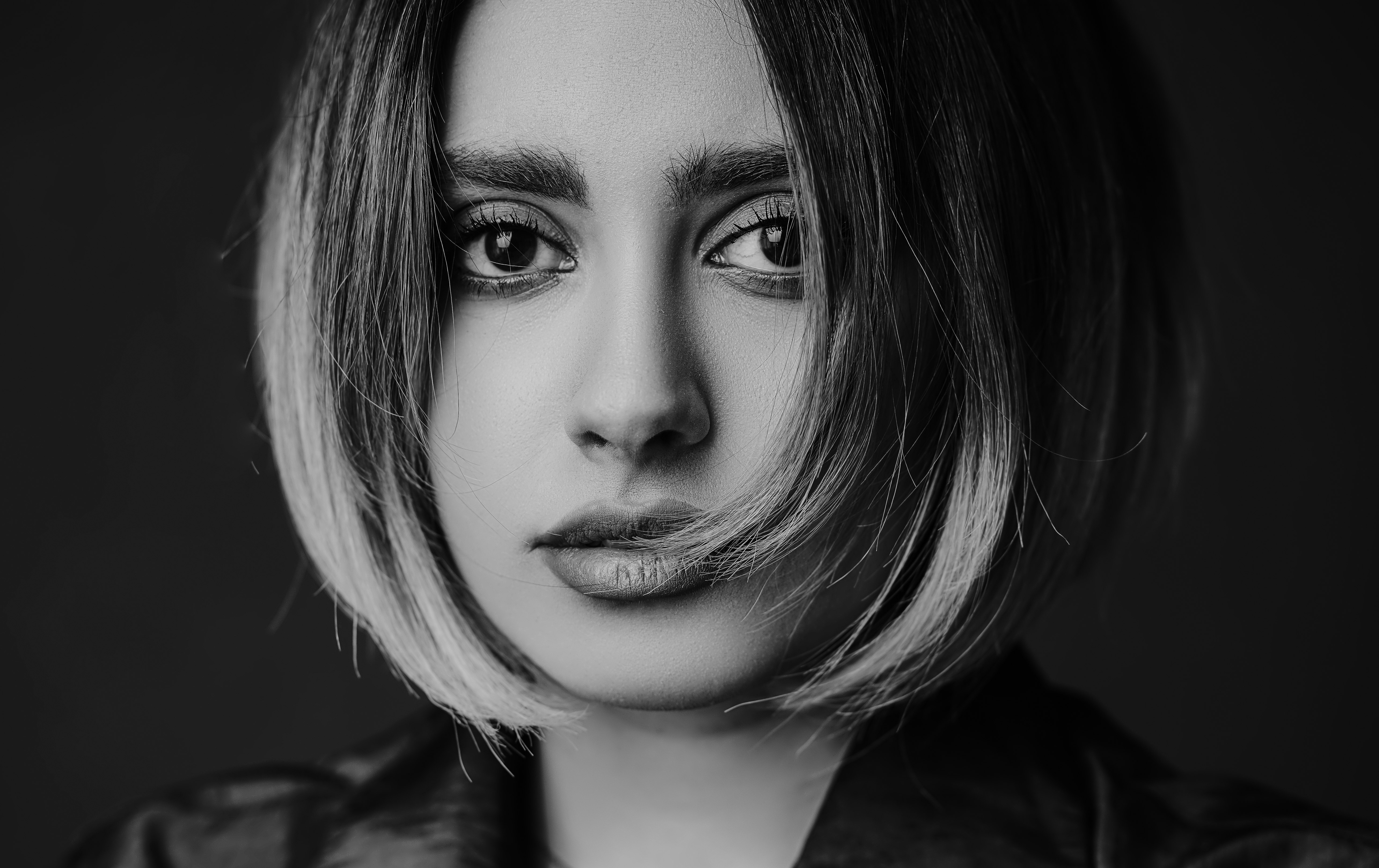 woman in black shirt with black mascara