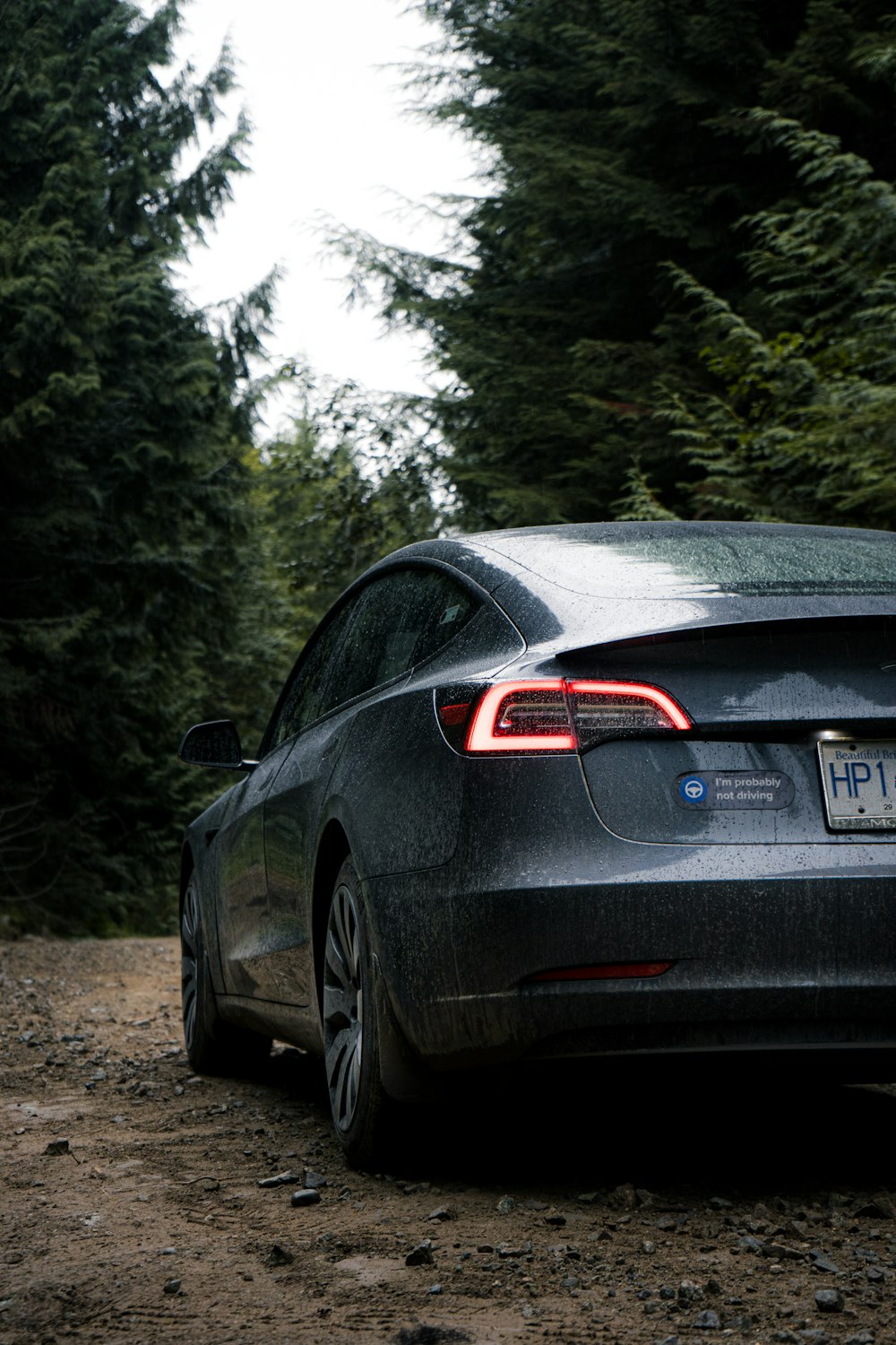 black car on dirt road