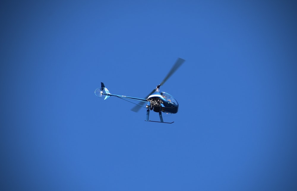 black and white drone flying in the sky