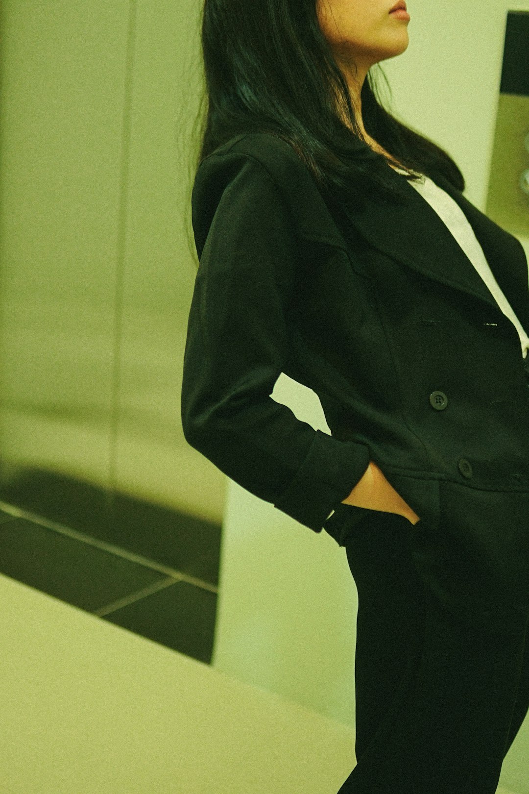 woman in black blazer standing
