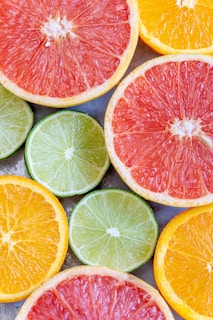 sliced orange and green citrus fruits