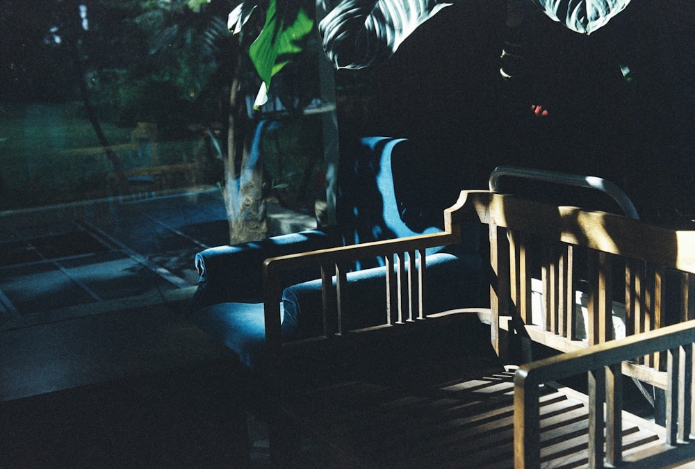 person sitting on brown wooden armchair