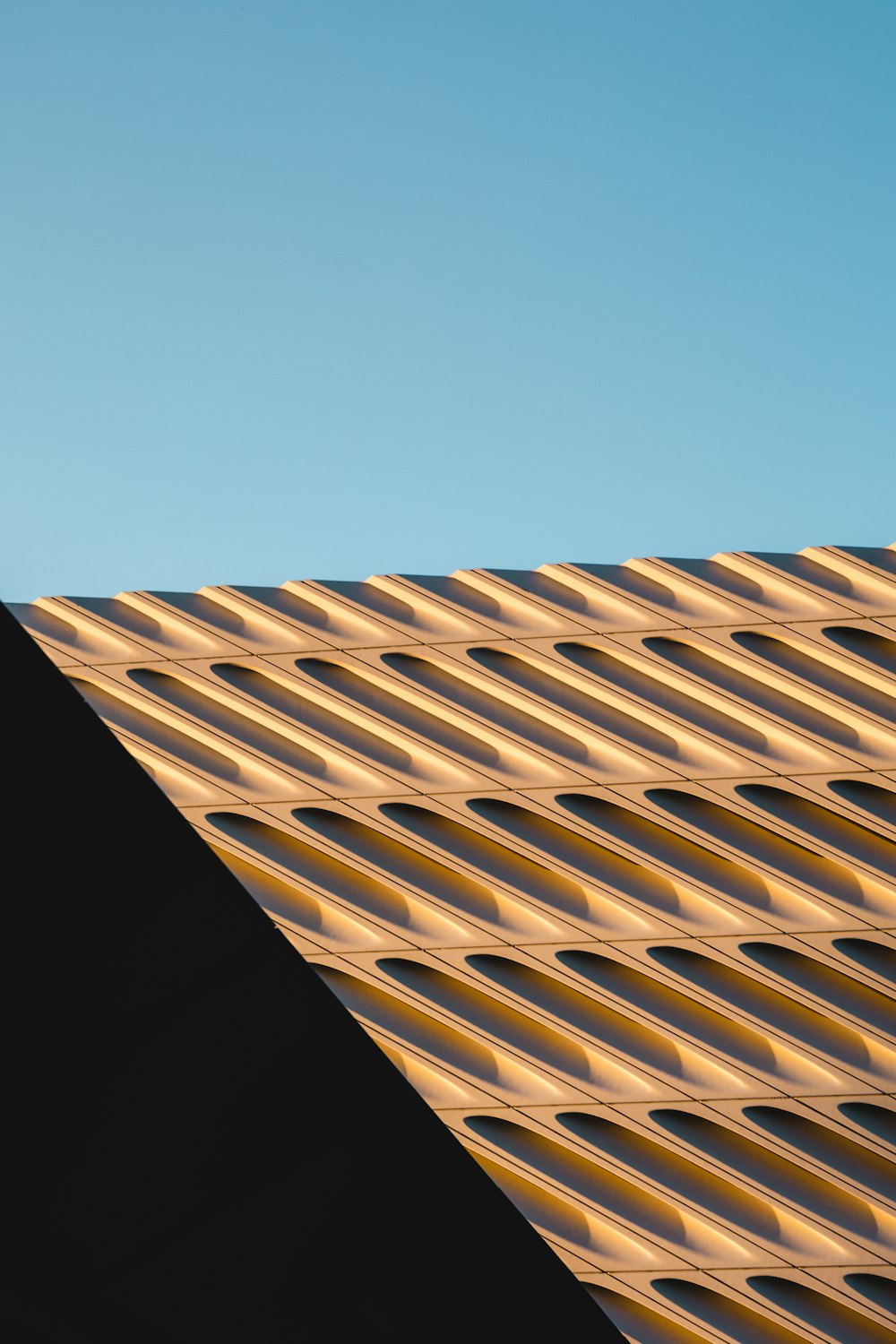 brown and white concrete building under blue sky during daytime