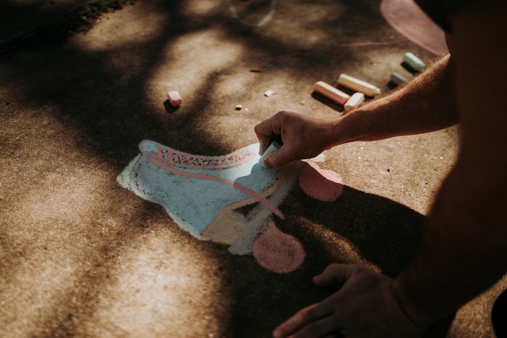 person holding white and pink underwear