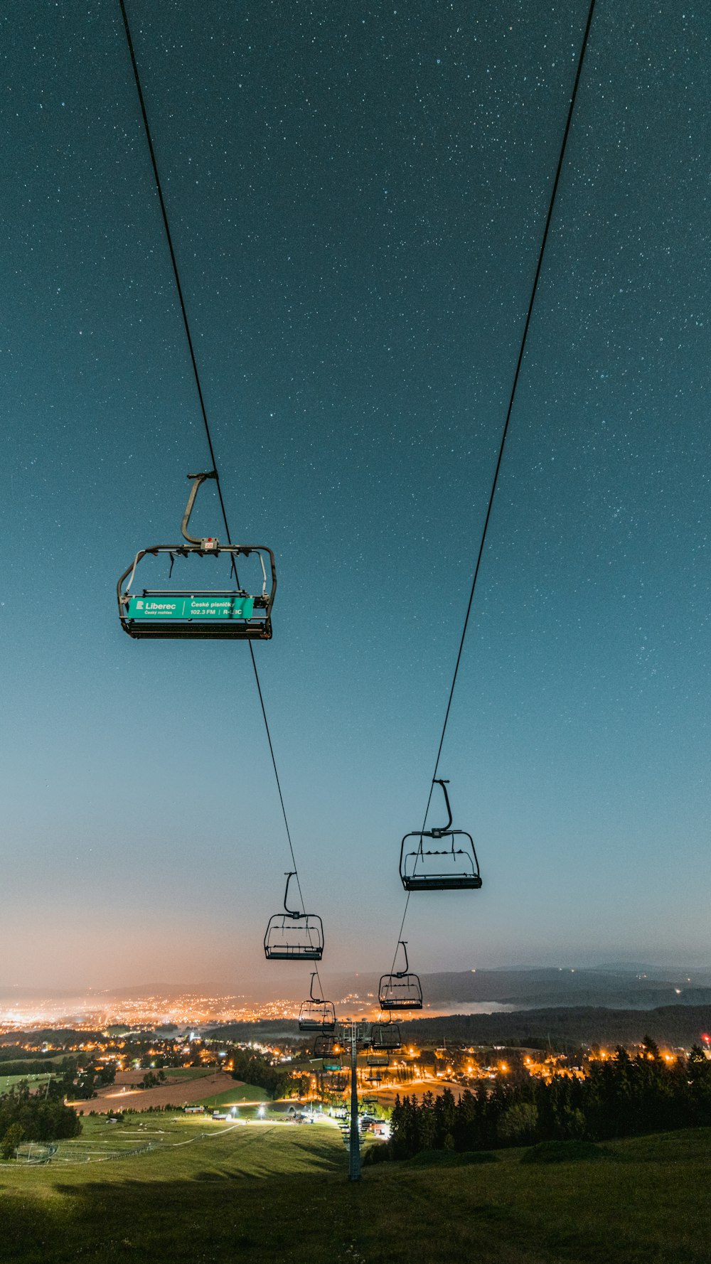 green cable car under blue sky during daytime