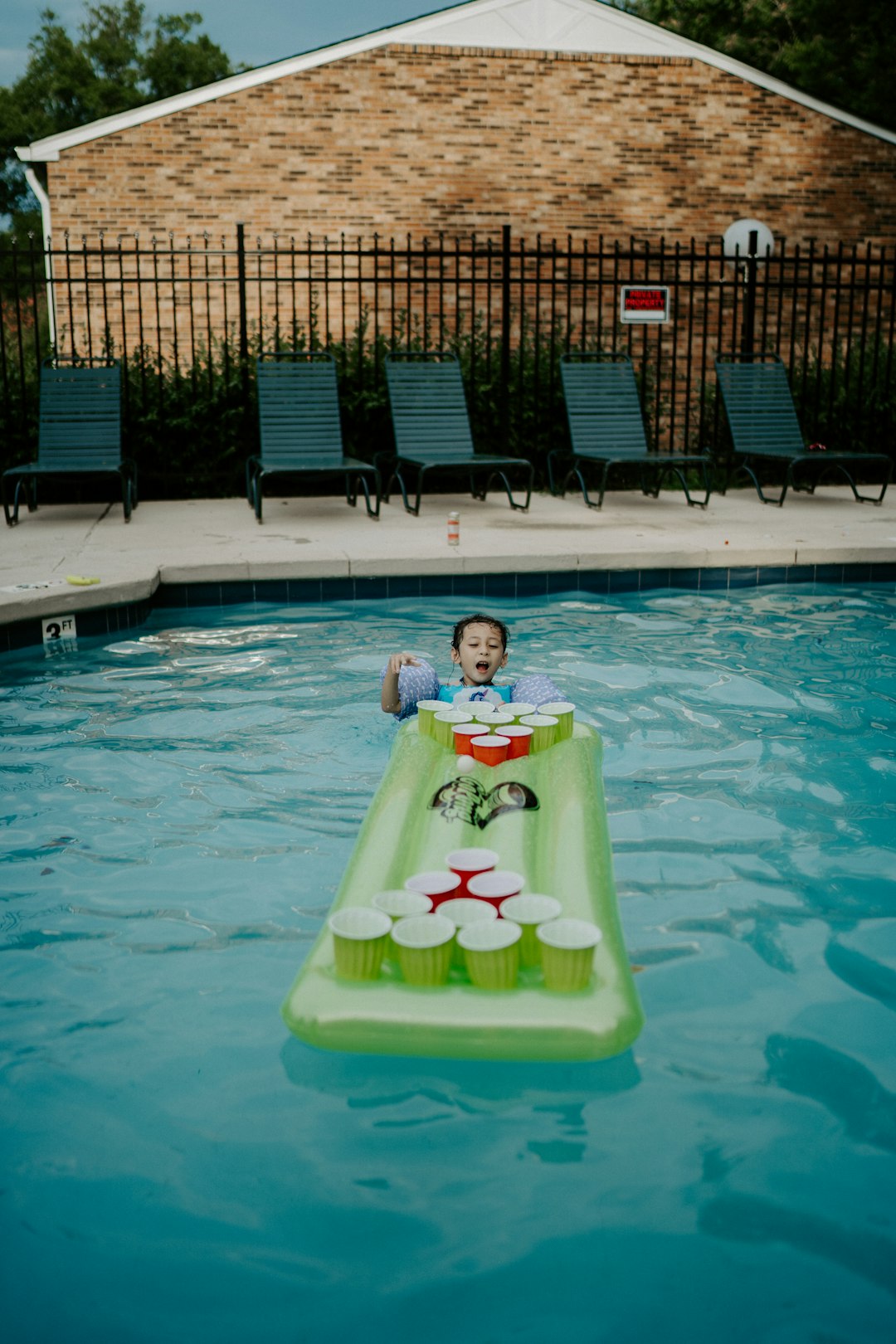 2 children in swimming pool during daytime