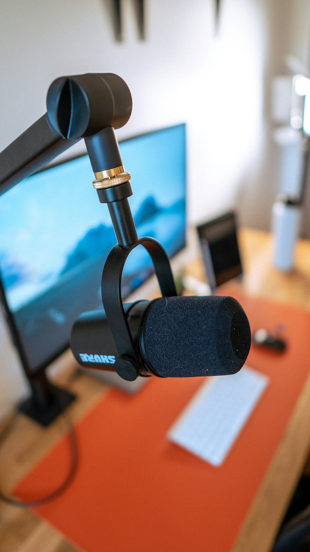 black and silver microphone with stand