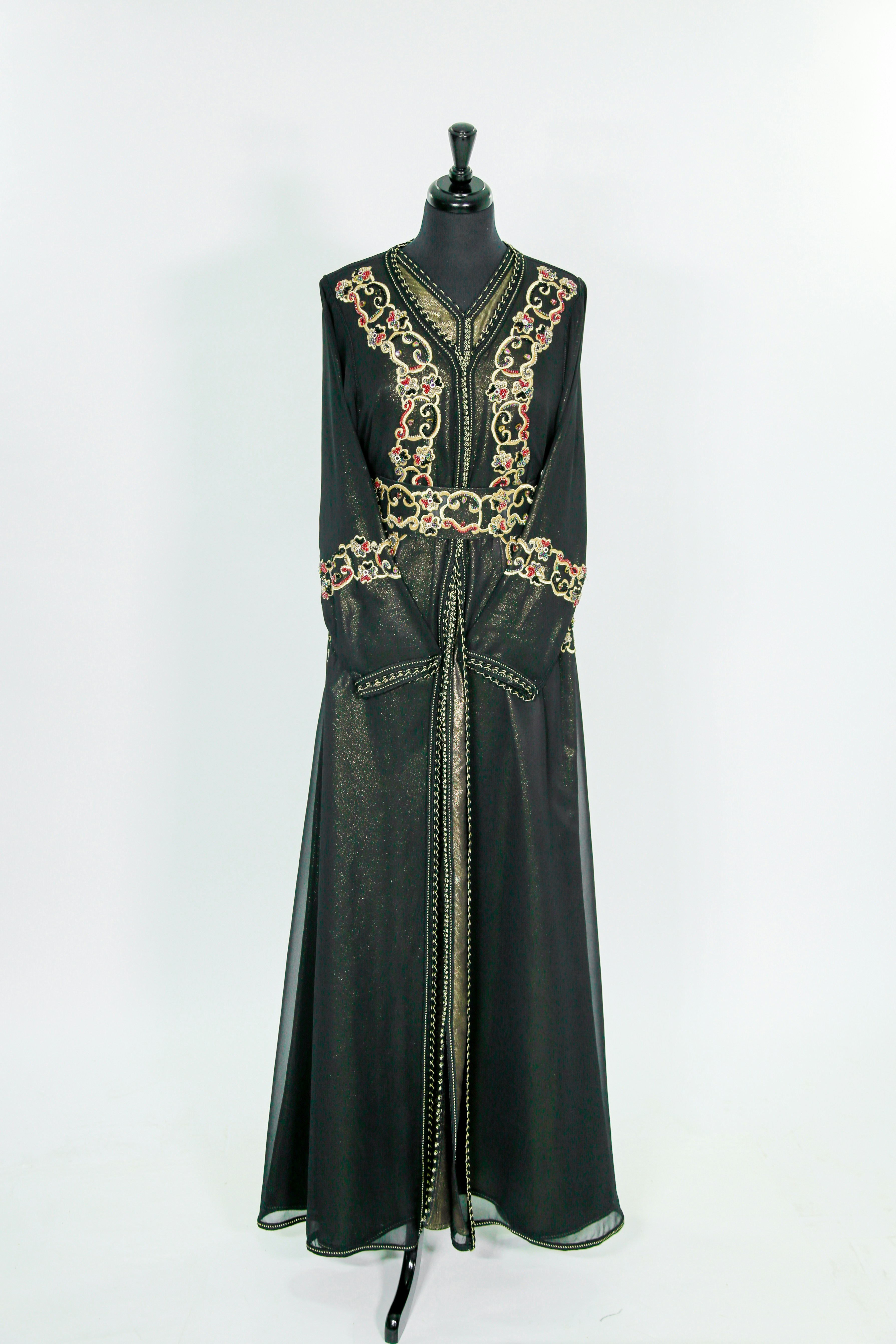 Elegant Ramadan collection featuring flowing emerald green abaya with gold embroidery and matching hijab