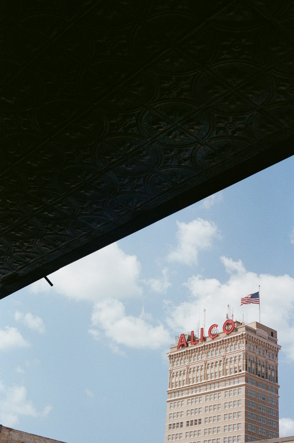 white and red concrete building under blue sky during daytime