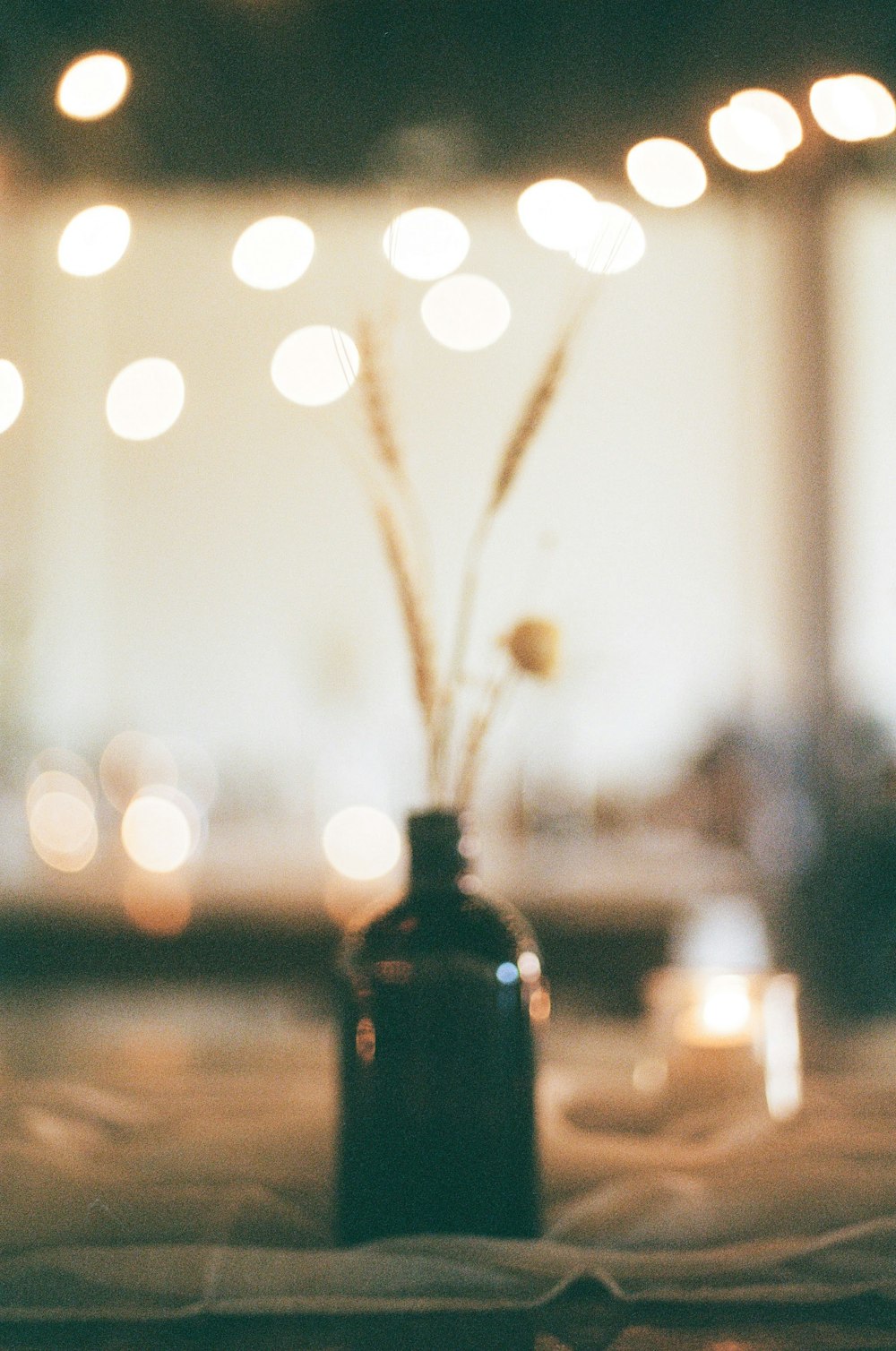 a vase filled with flowers sitting on top of a table