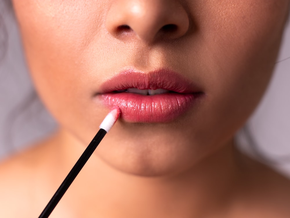 woman with red lipstick and black eyeshadow