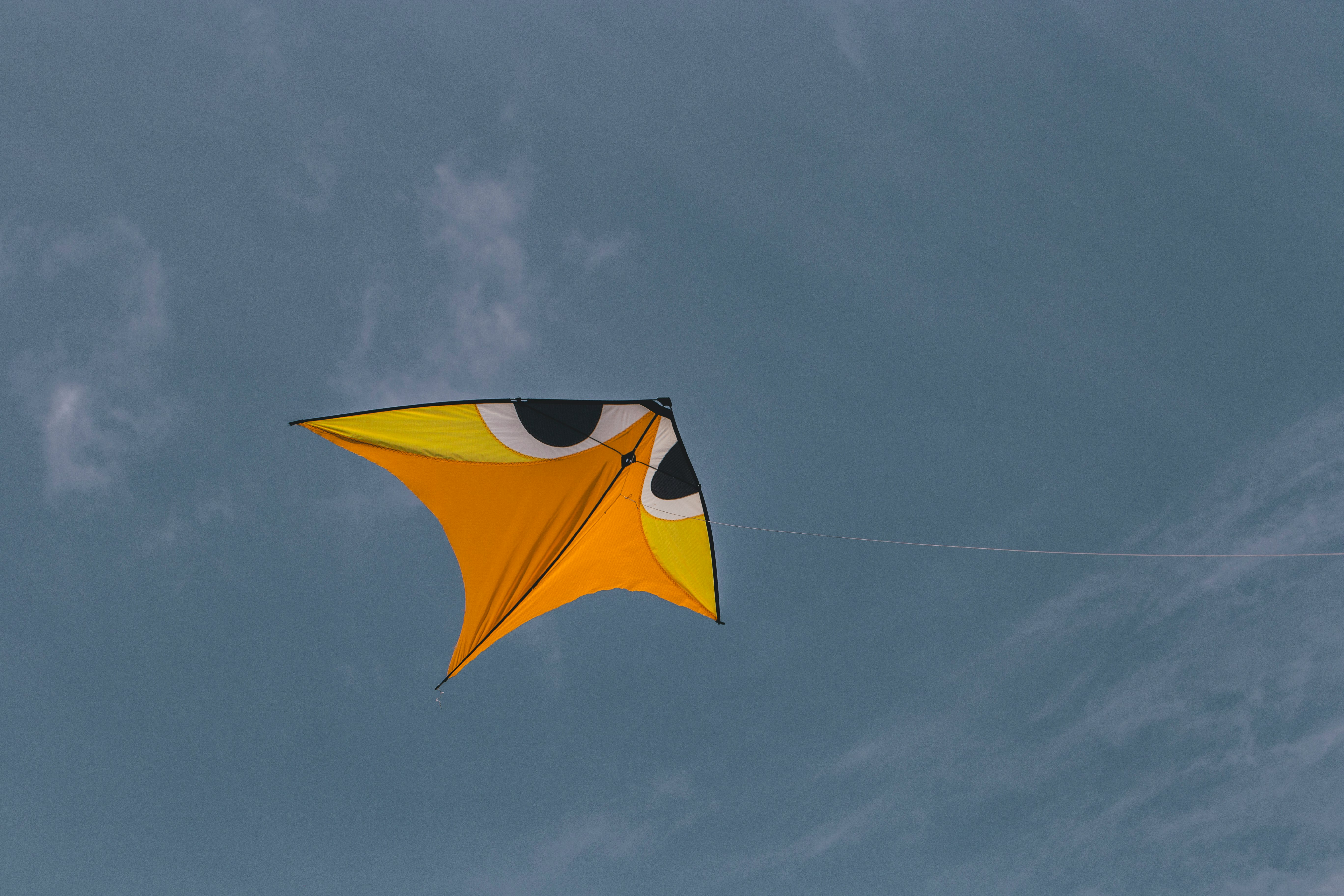 yellow and black umbrella under blue sky