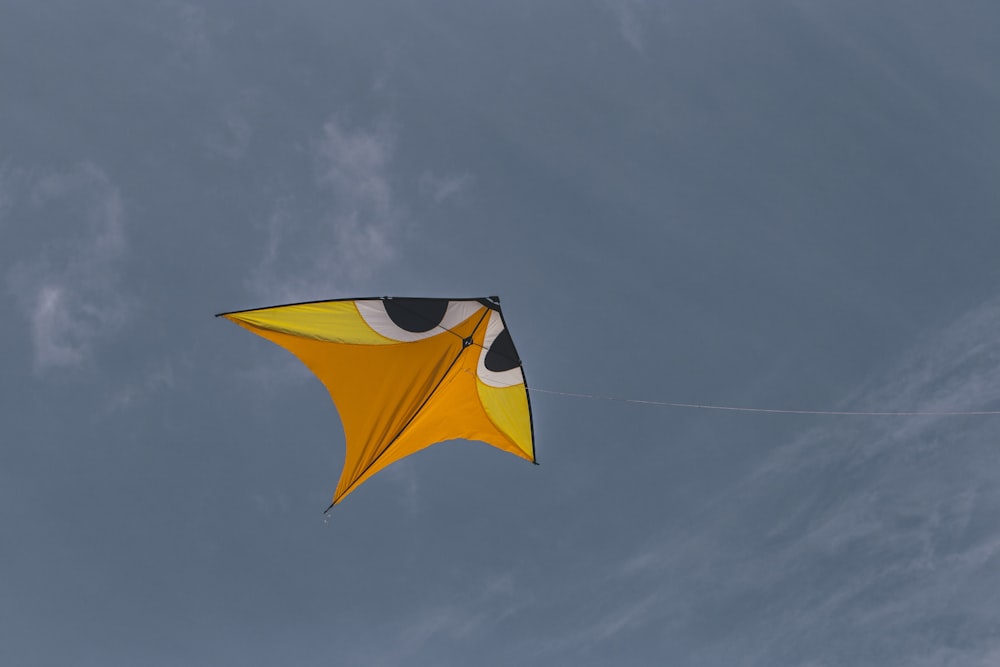 yellow and black umbrella under blue sky