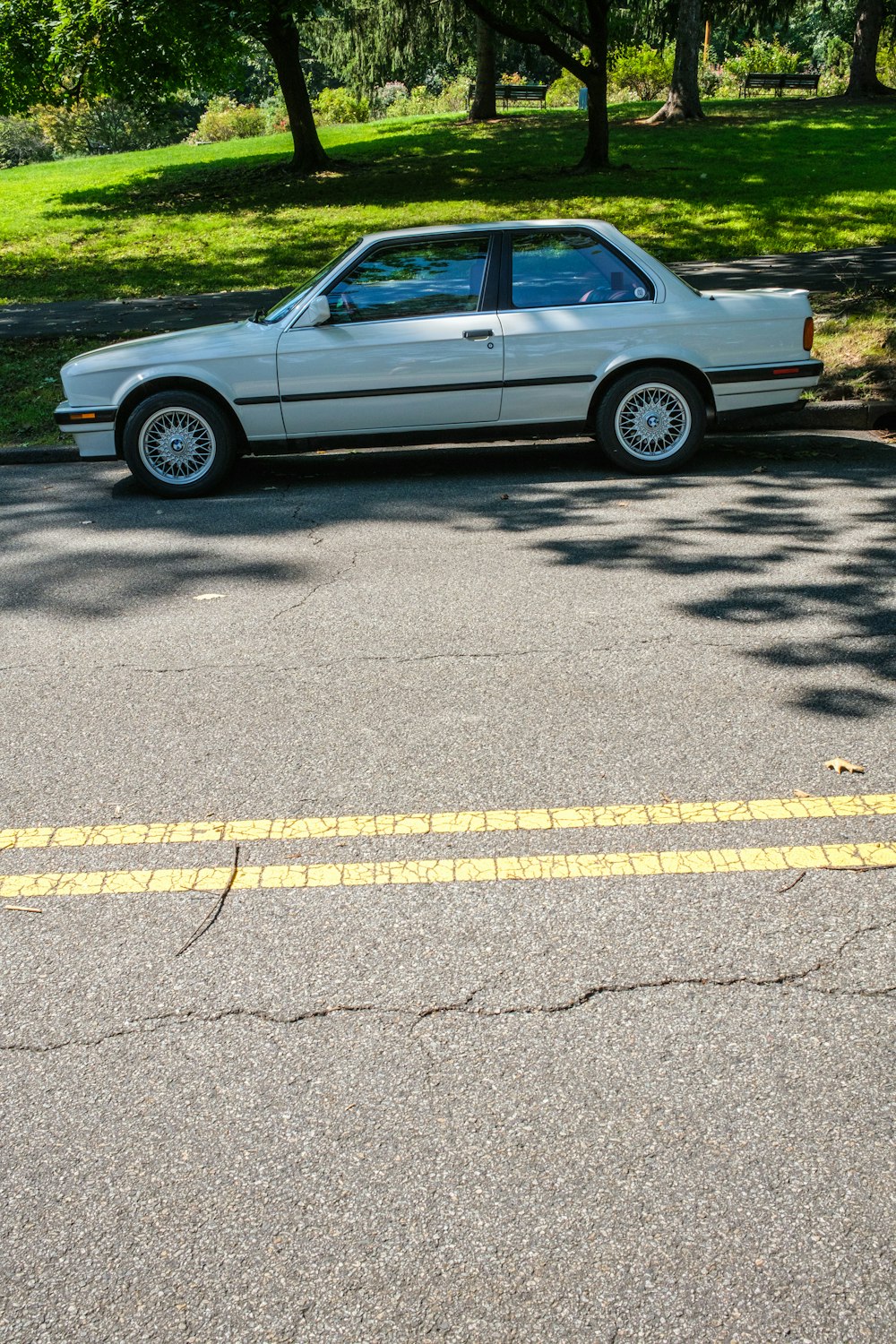 silver sedan on road during daytime