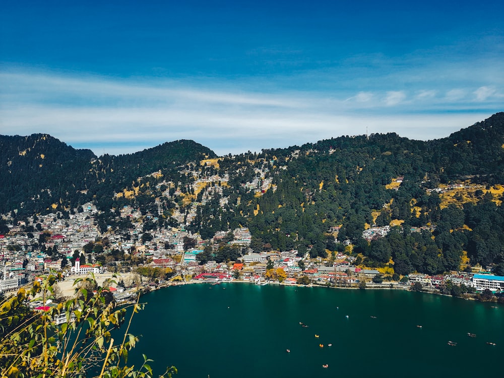 city near body of water under blue sky during daytime