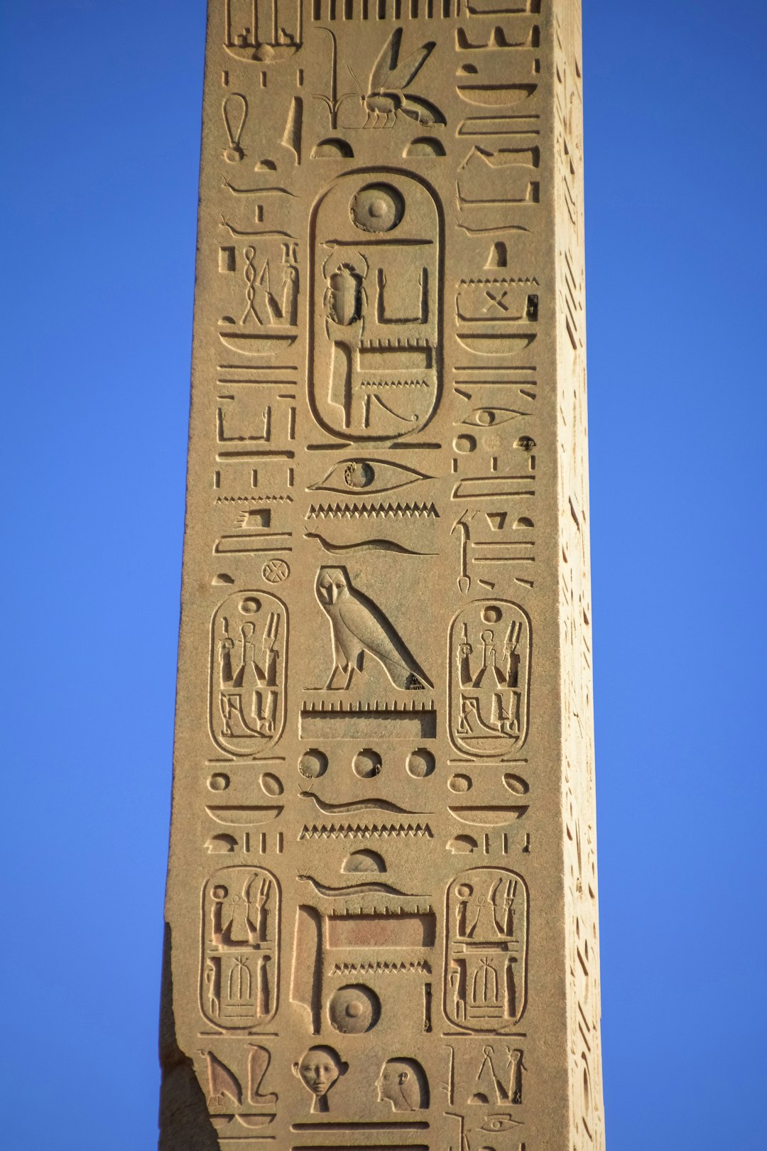 gray concrete cross under blue sky during daytime