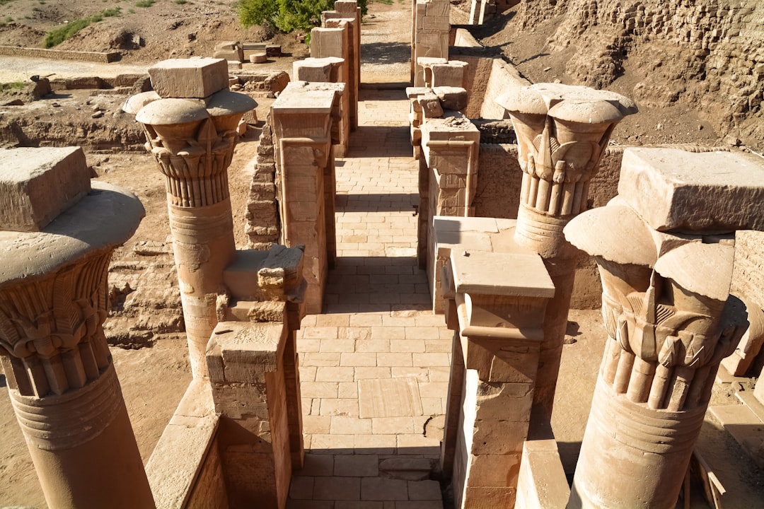 brown concrete blocks on brown sand during daytime