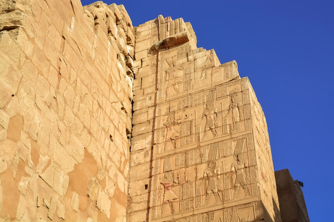 brown concrete building under blue sky during daytime