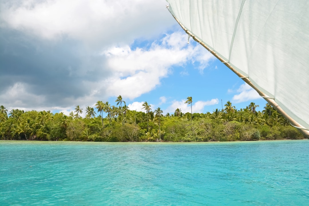 white sail boat on blue sea during daytime