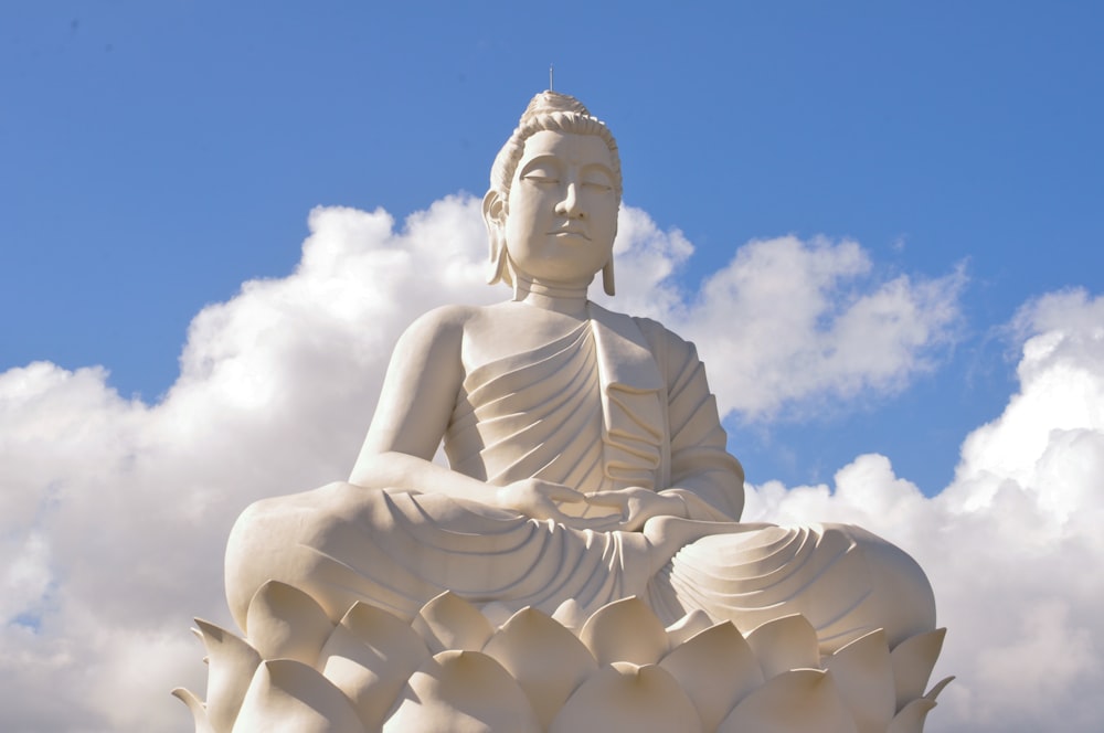 white concrete statue under blue sky during daytime