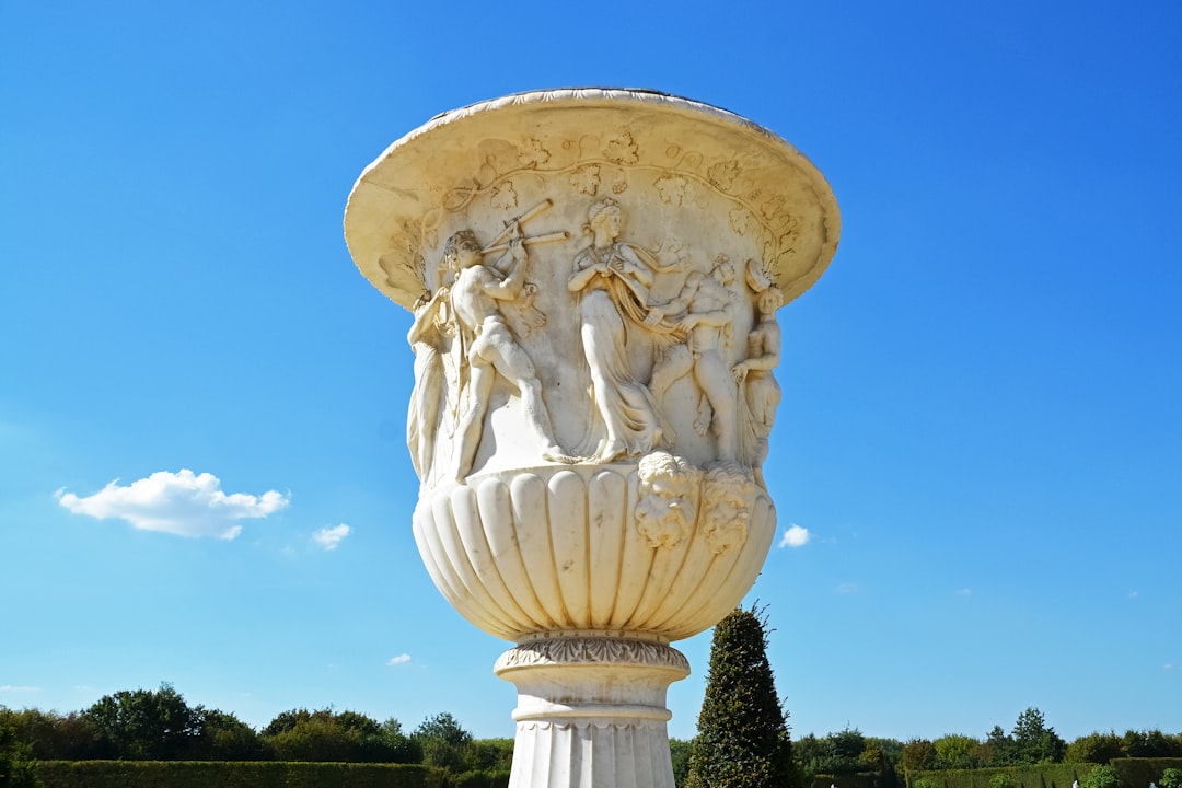 white concrete statue under blue sky during daytime