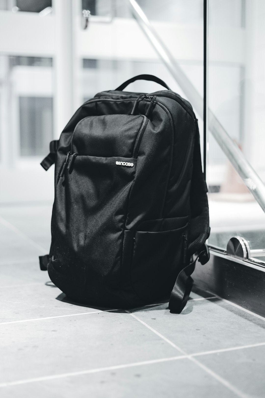 black backpack on white floor
