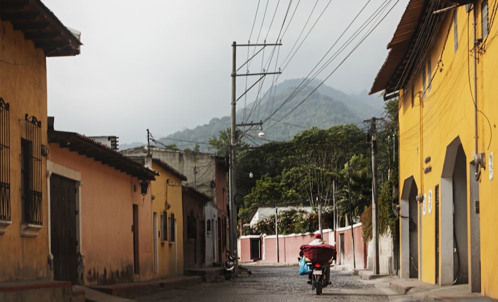 person in red shirt riding on red bicycle during daytime