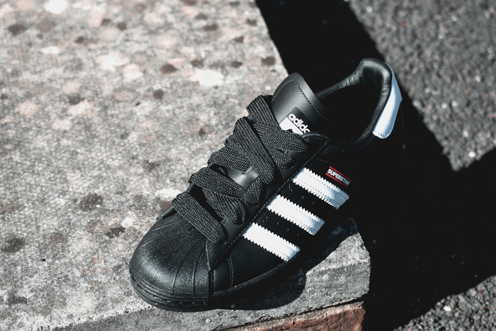 black and white adidas lace up shoe