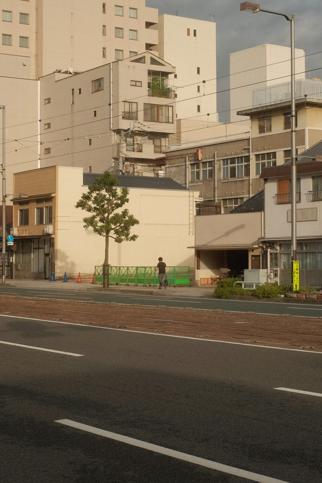 white concrete building near green trees during daytime