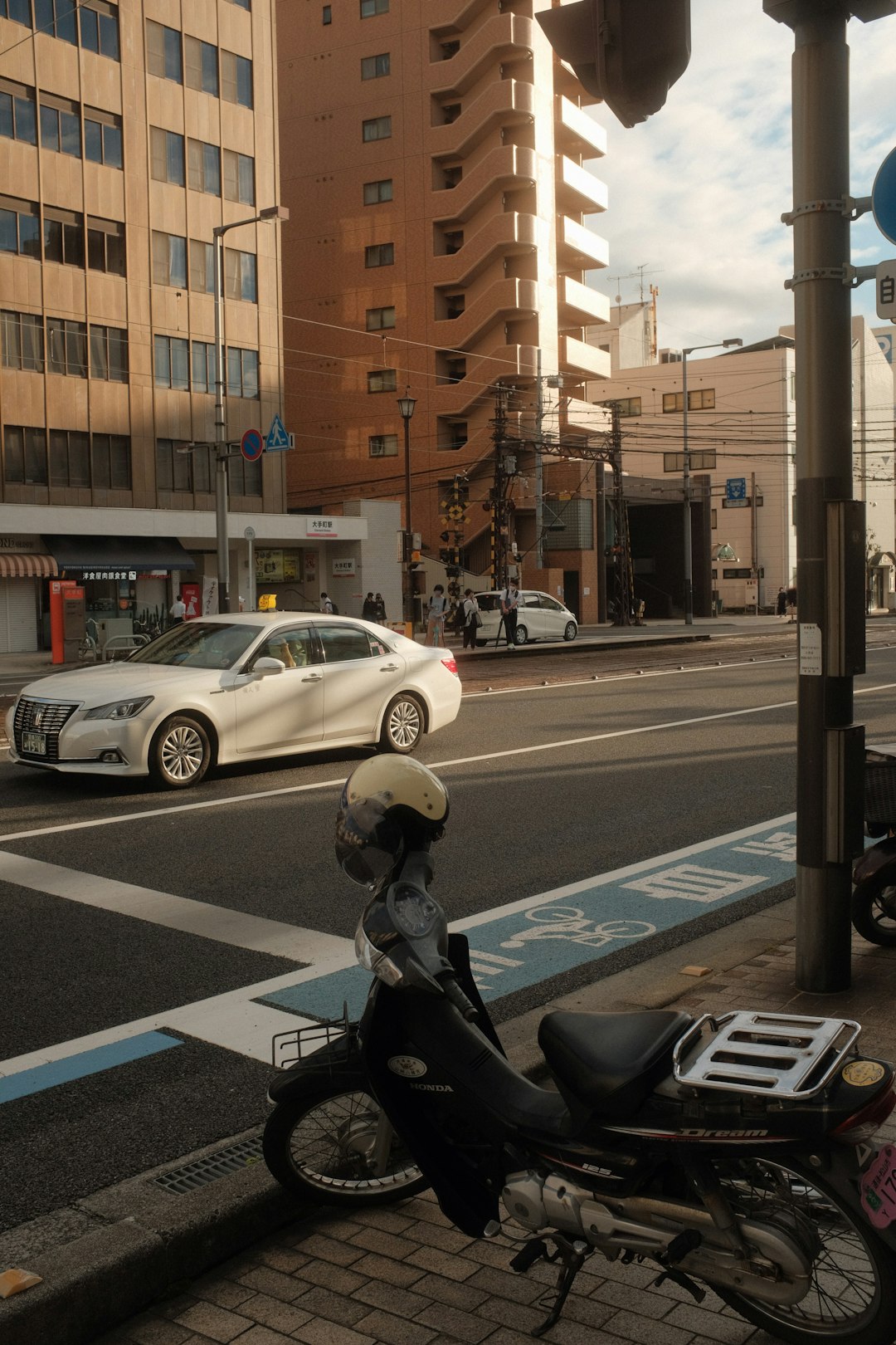 man in black jacket riding on motorcycle on road during daytime