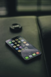 black samsung android smartphone on black leather textile