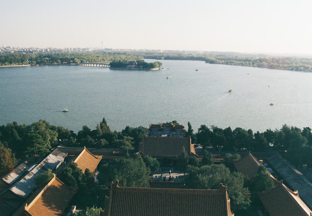 aerial view of city near body of water during daytime