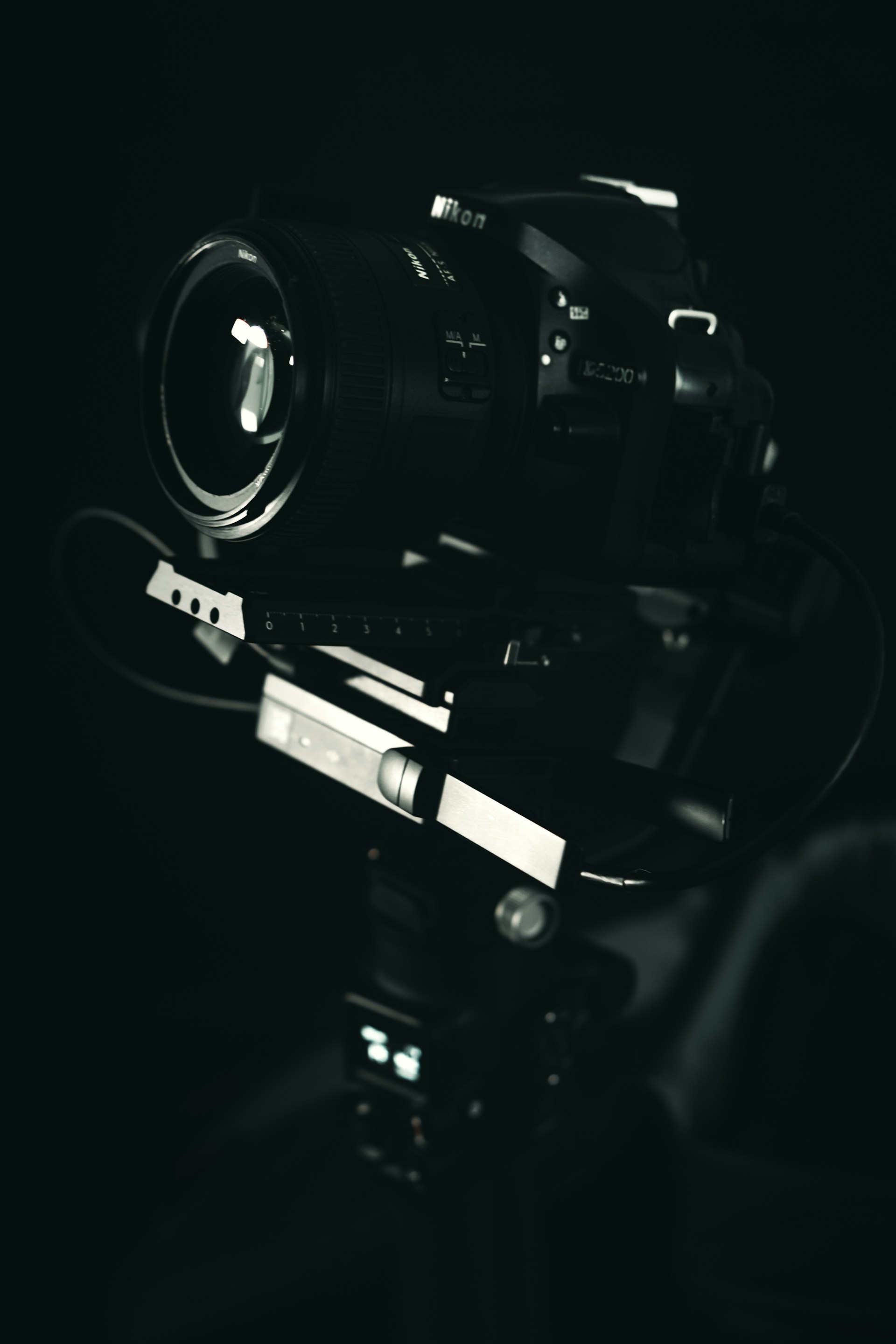 black dslr camera on black surface