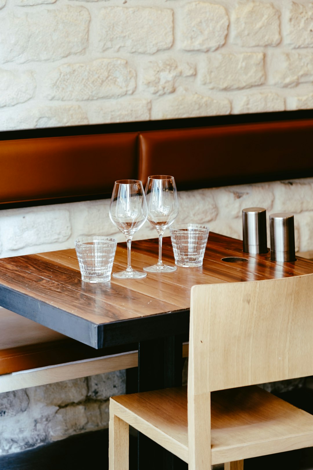 clear drinking glasses on brown wooden table