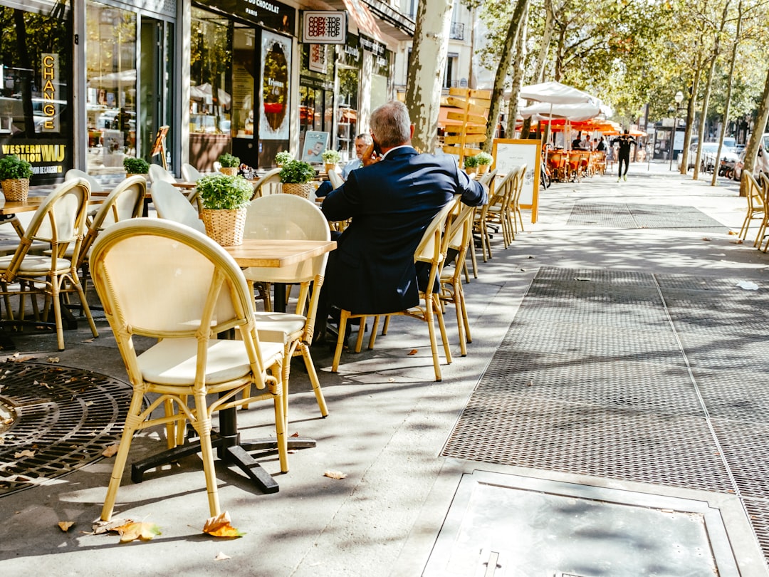 people sitting on chair near table during daytime